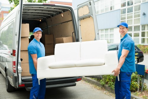 Removal van supporting a same day move on a residential street in Belsize Park