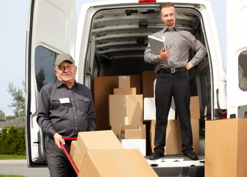 Careful flat move in Belsize Park with boxes and household items being loaded