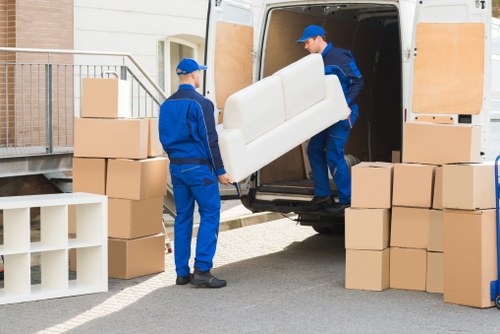 Man and van vehicle and moving crew preparing for a service booking