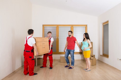 Professional team removing office furniture during a commercial pick-up in Belsize Park