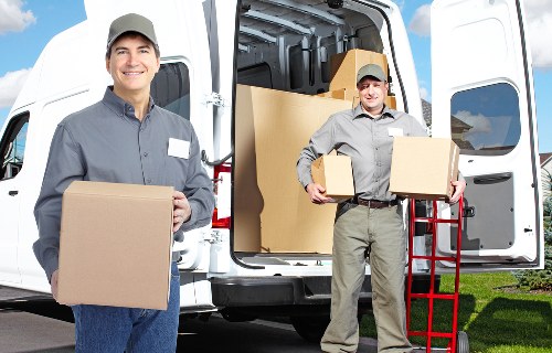 Careful loading of household items for a move in Belsize Park