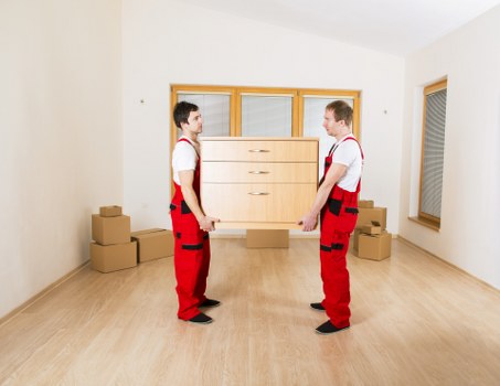 Office furniture and boxes loaded for a same day commercial move in Belsize Park